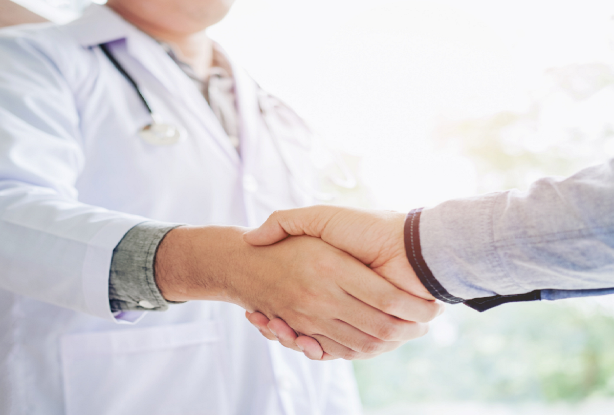 Patient and doctor shaking hands